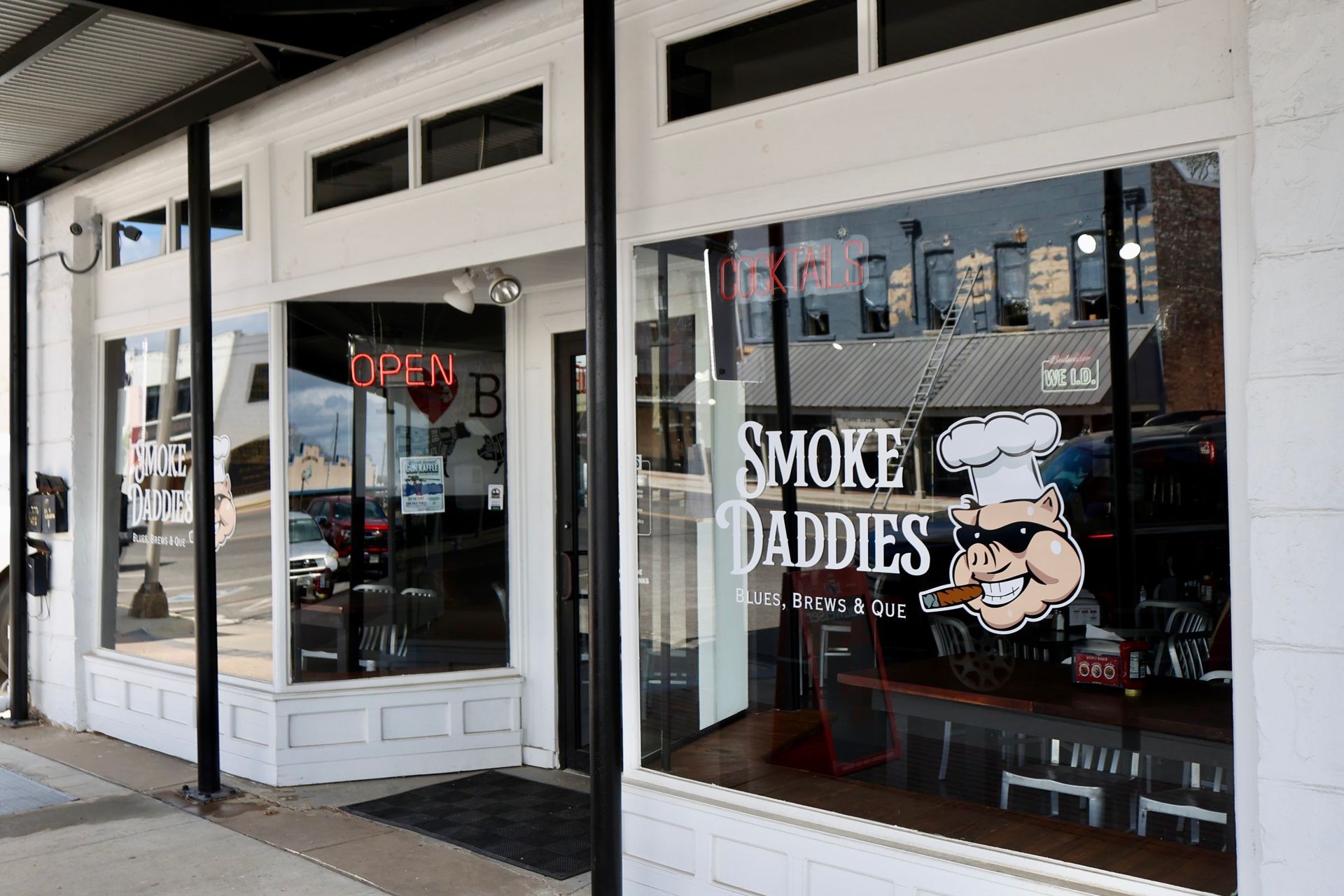 A nighttime view of a storefront for 