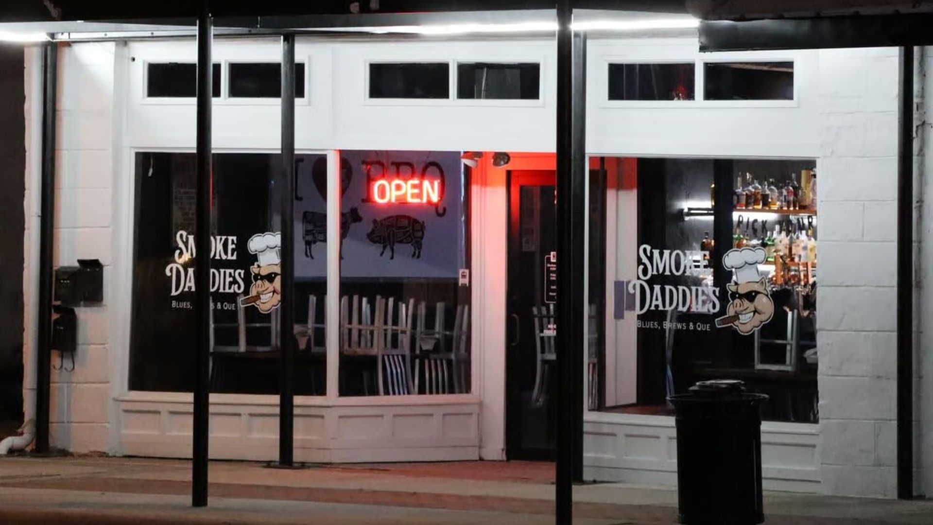 A nighttime view of a storefront for 