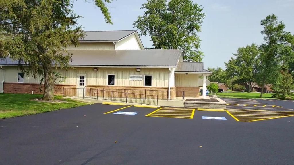 Picture of routine maintenance and touch-ups being performed on pavement marking by Midwest Seal Team in Fort Wayne, IN.
