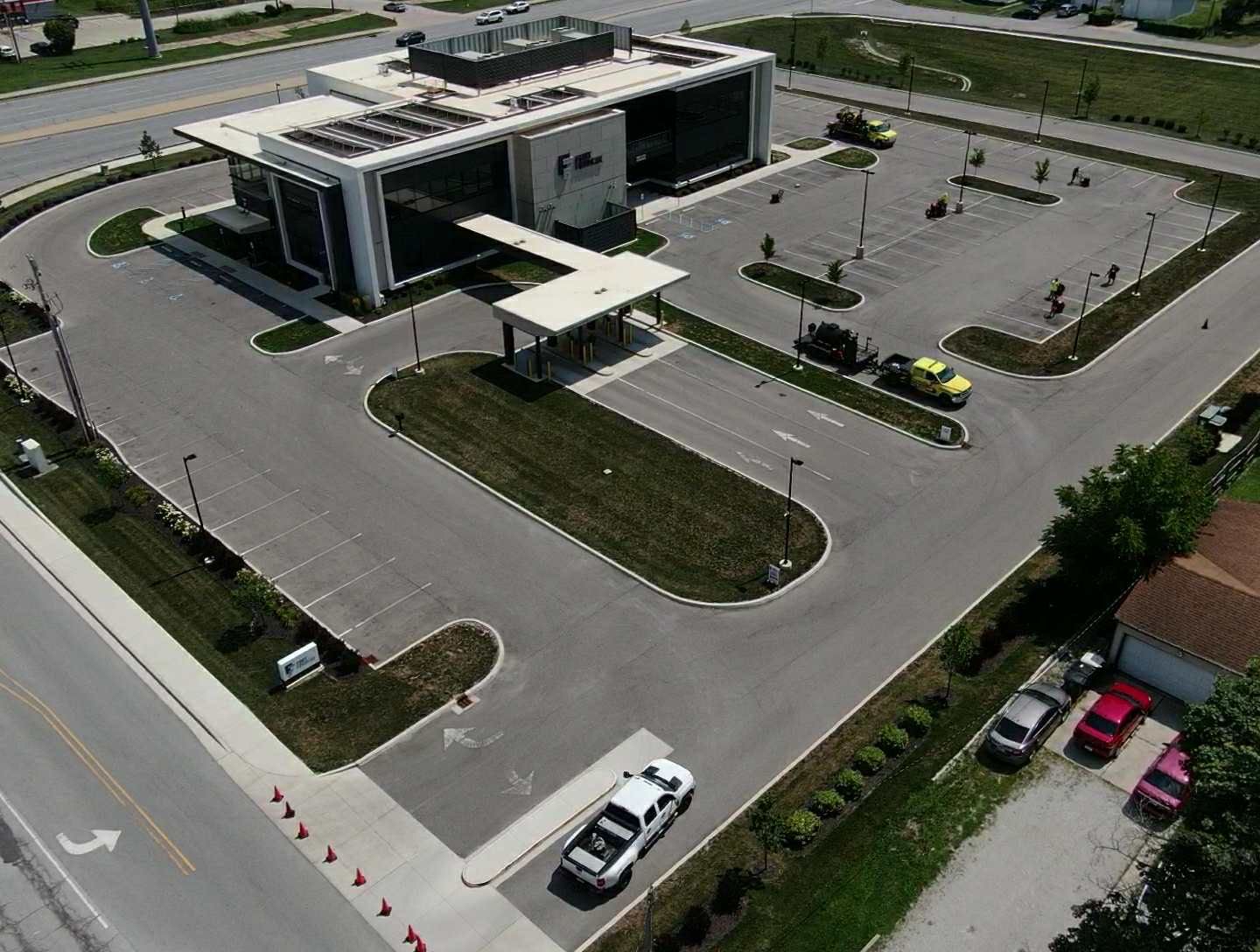 Picture of a Parking lot in Van Wert Ohio that needs to be restriped and sealcoated. You can see the parking area has faded parking lines. 