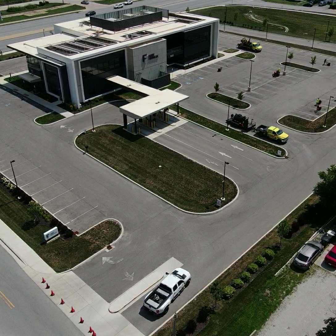 Picture of a Parking lot in Fort Wayne, IN that needs to be restriped and sealcoated. You can see the parking area has faded parking lines. 