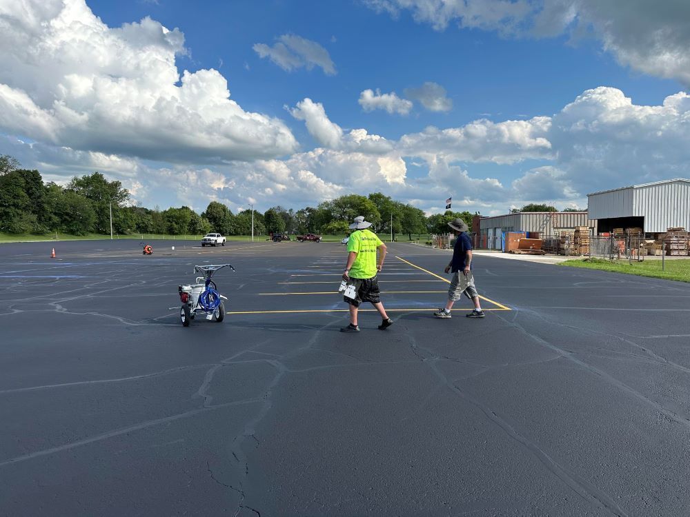 Picture of a dedicated team from Midwest Seal Team providing parking lot striping services in a commercial parking lot in Fort Wayne, IN.
