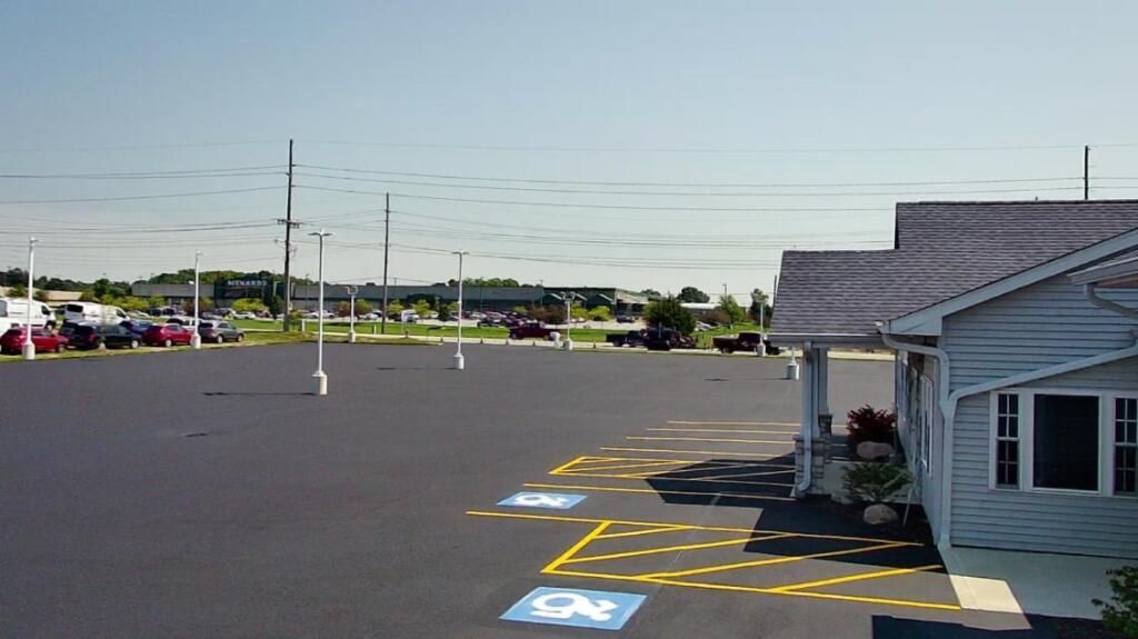 Sealcoating a commercial parking lot in Fort Wayne, IN. 
