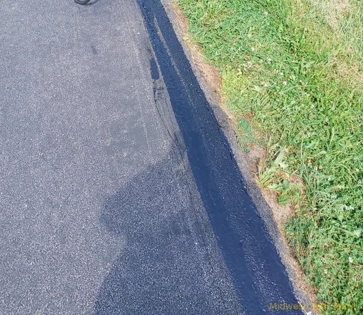 Image of a side of a road that has been repaired in Auburn Indiana. 