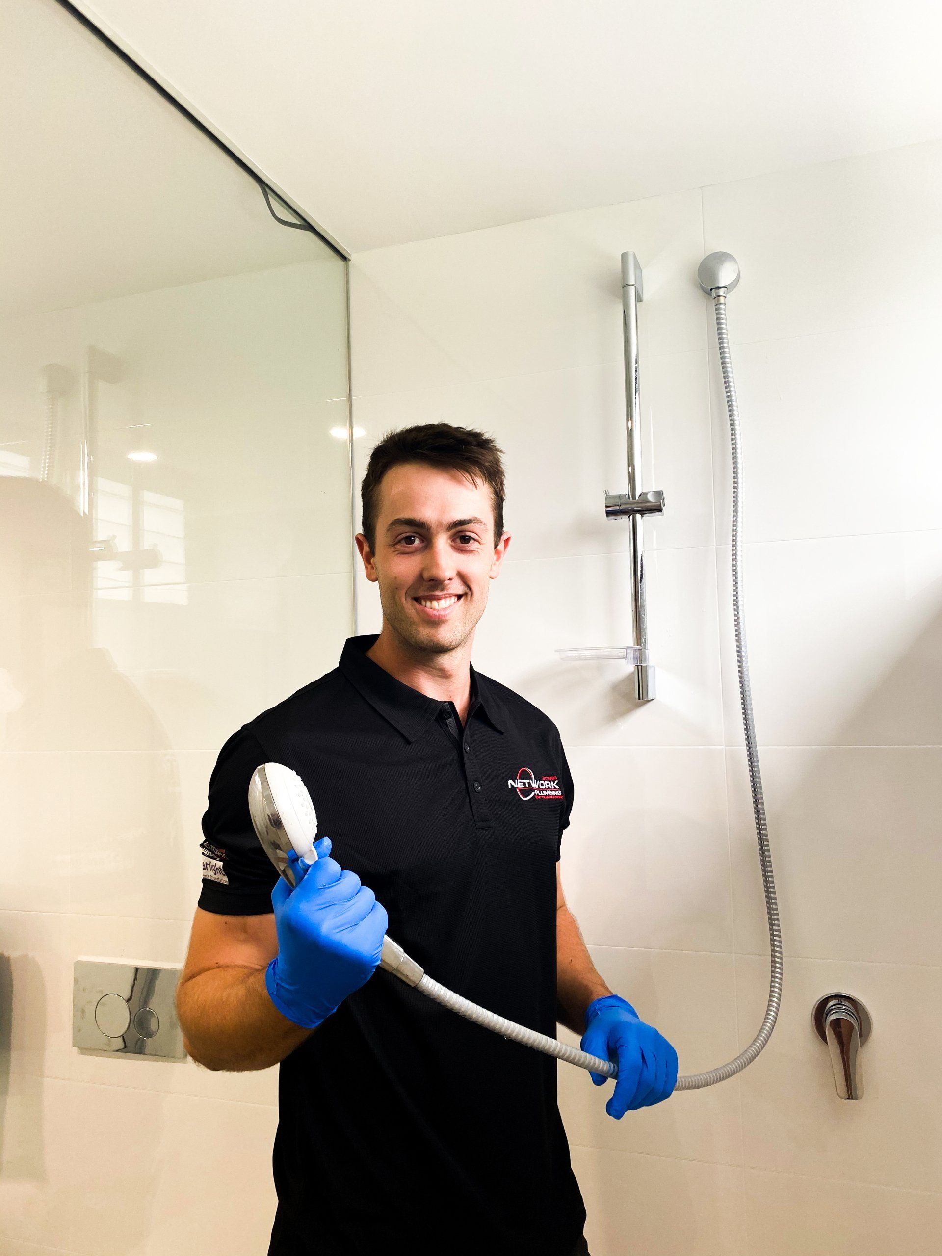 Sydney plumber fixing hot water shower tap