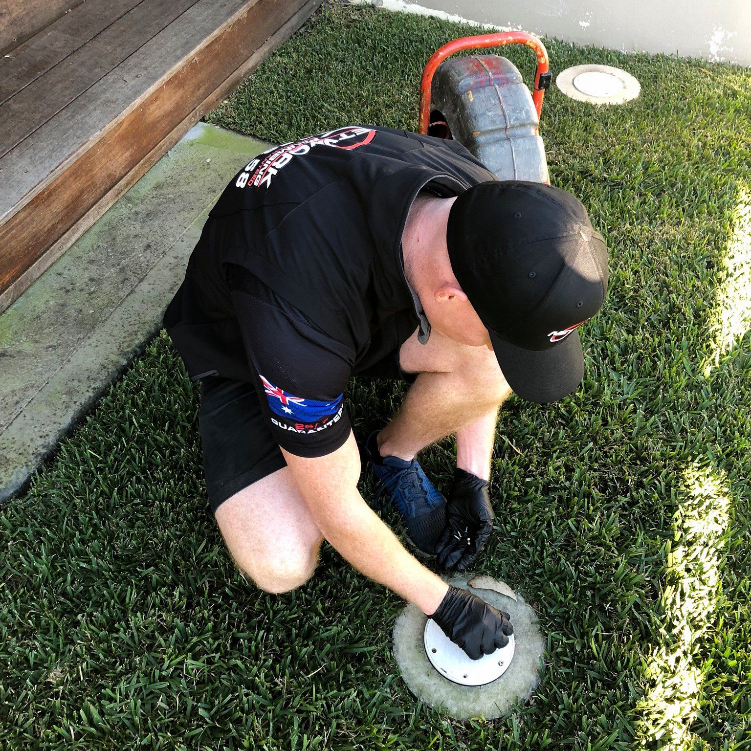 Network Plumbing plumber inspecting a blocked sewer line