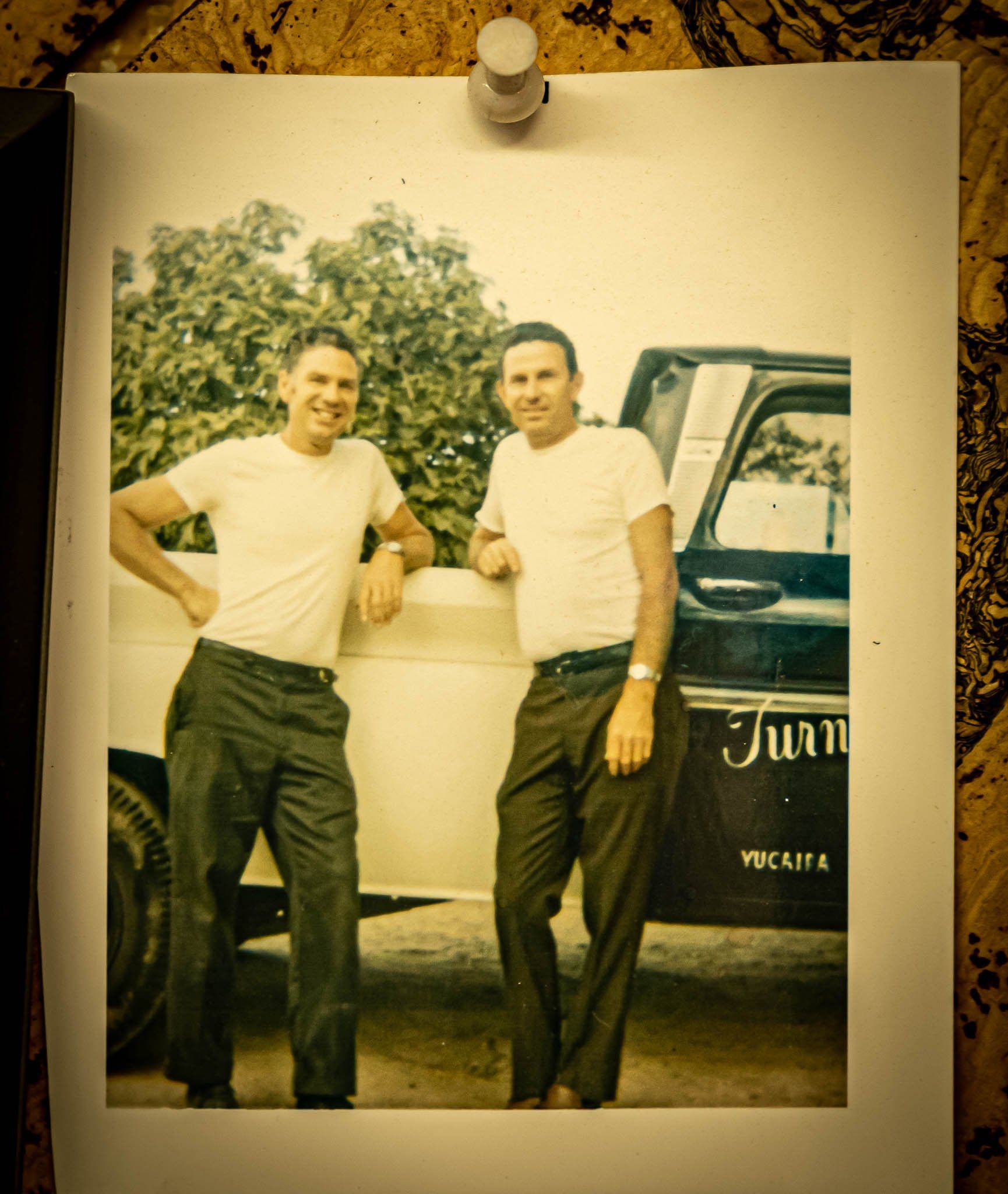 Dennis Turner with brother Darrrell Turner standing next to the Turner's Fine Carpets Truck in the 1960's