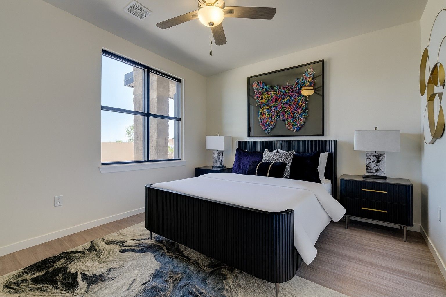 large bedroom with bed and big window