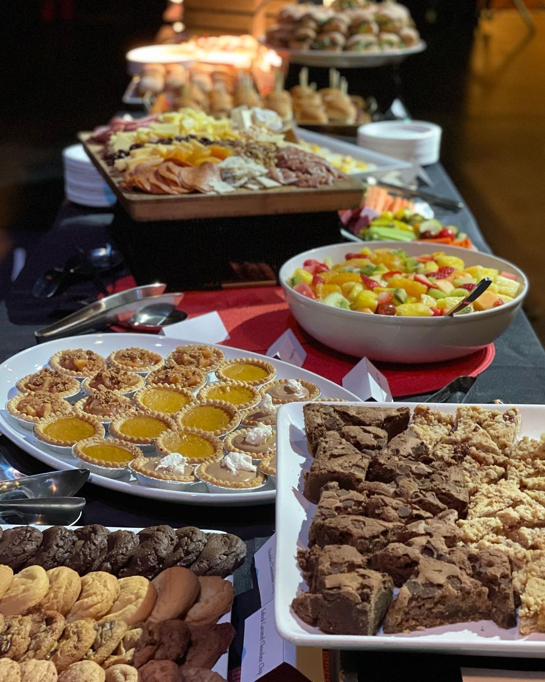 A buffet table with a variety of food on it