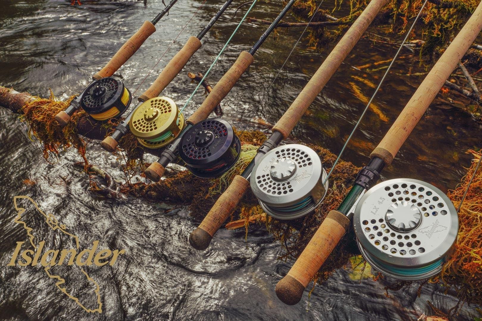 Fly rods with reels are resting over a rushing river, featuring cork handles and metallic reels.