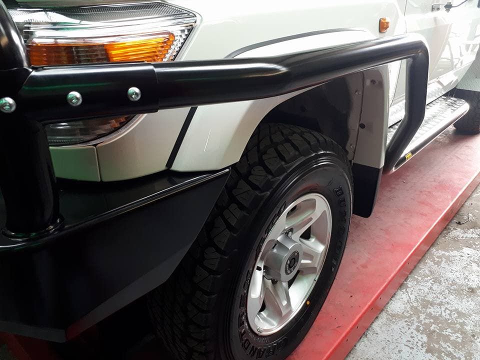 A White Truck With A Black Bumper Is Parked On A Red Surface — Goulburn Automotive Centre In Goulburn, NSW