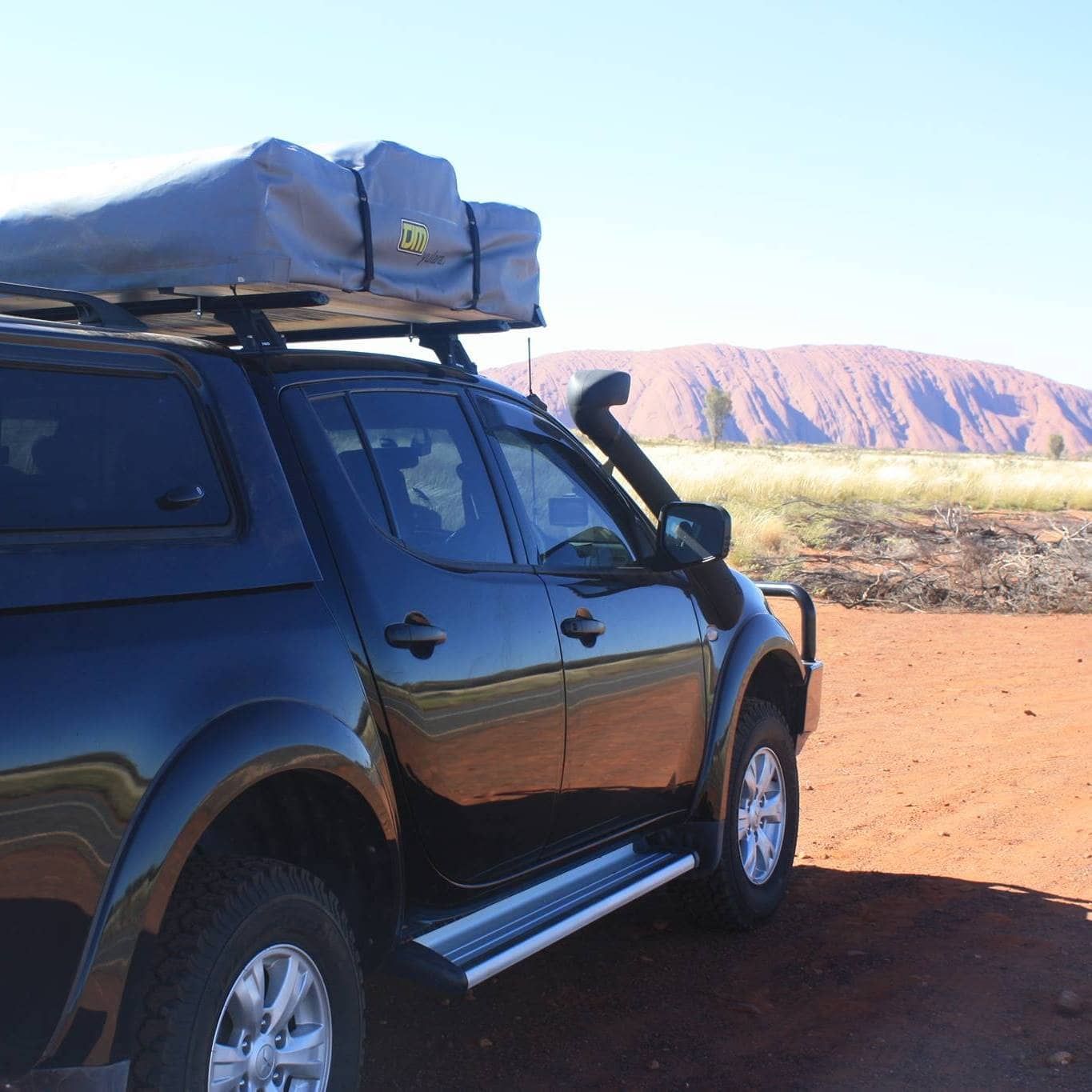 A Black Truck With A Tent On Top Of It — Goulburn Automotive Centre In Goulburn, NSW