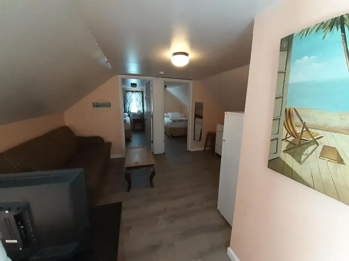 A living room with a couch and a flat screen tv