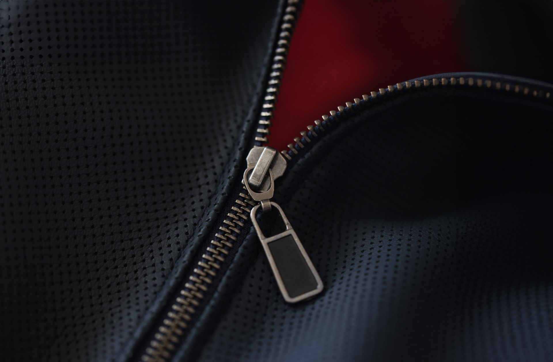 Closeup of steel zipper on leather jacket
