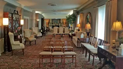 A large room filled with furniture and chairs.