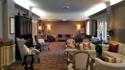 A living room filled with furniture and a fireplace.