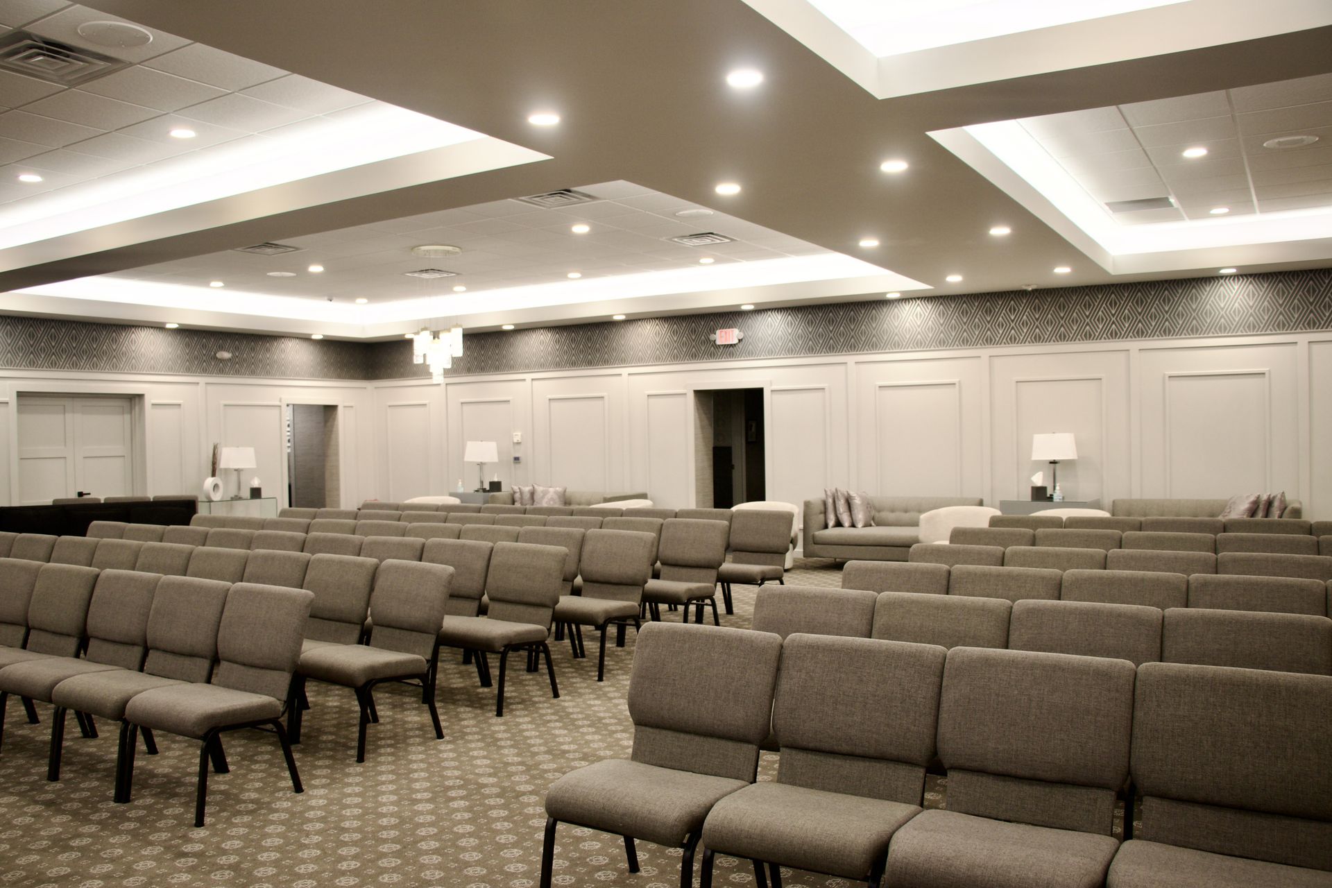 A large room with rows of chairs in it