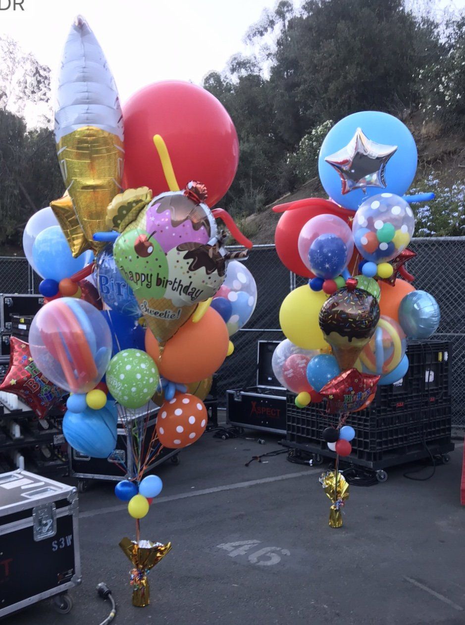 Birthday helium balloon filled bouquet with large foil numbers. 