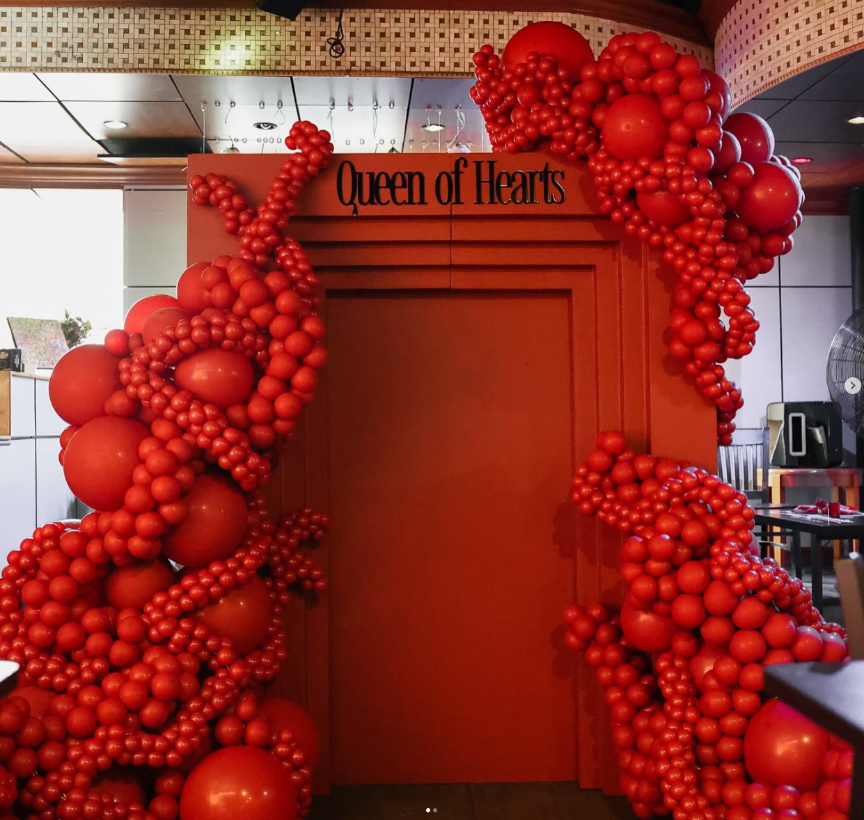 Red Organic Balloon Garland with Custom photo wall backdrop 