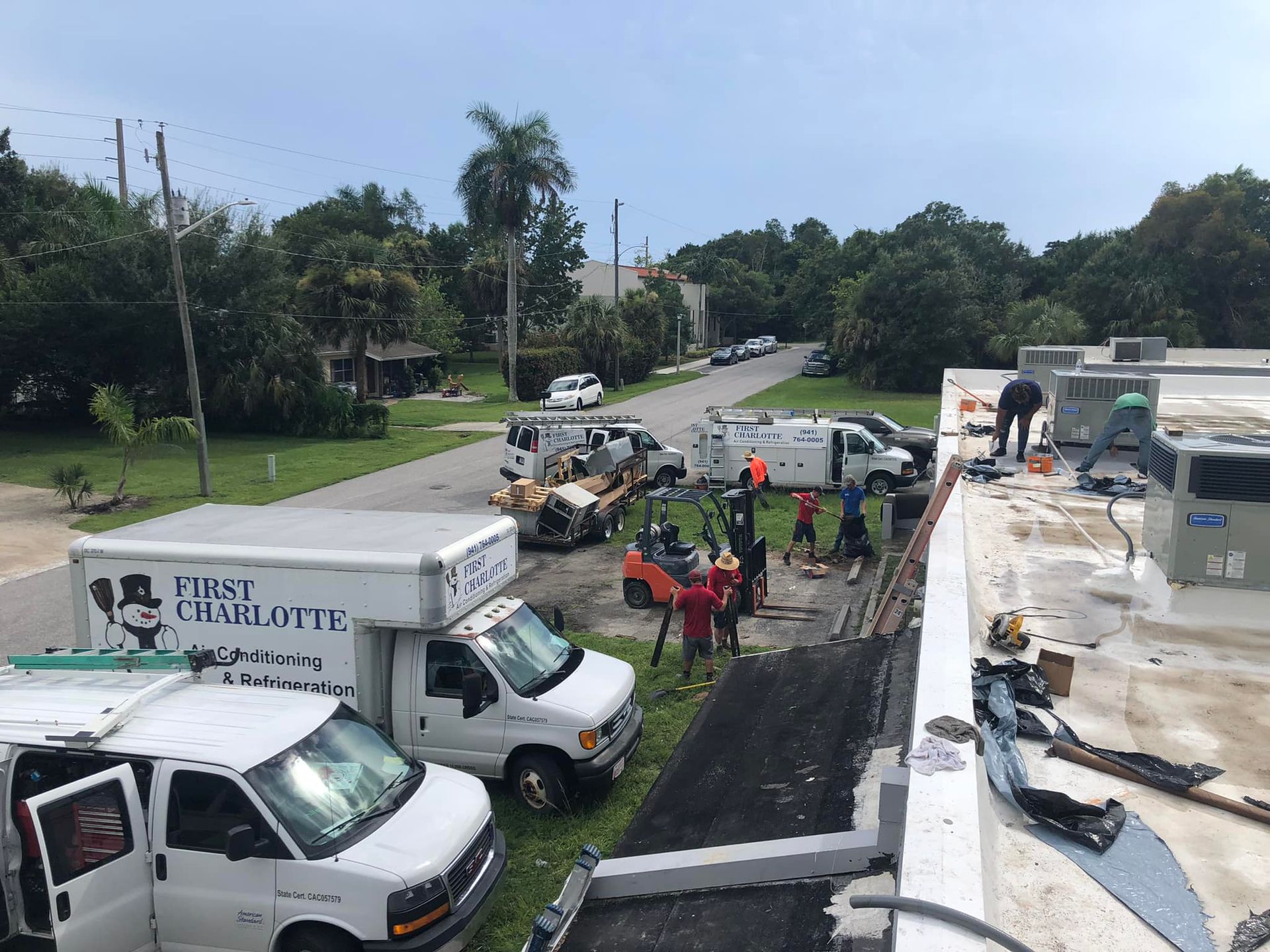A group of trucks are parked in front of a building.