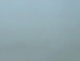 A close up of a light blue background with a plain texture.