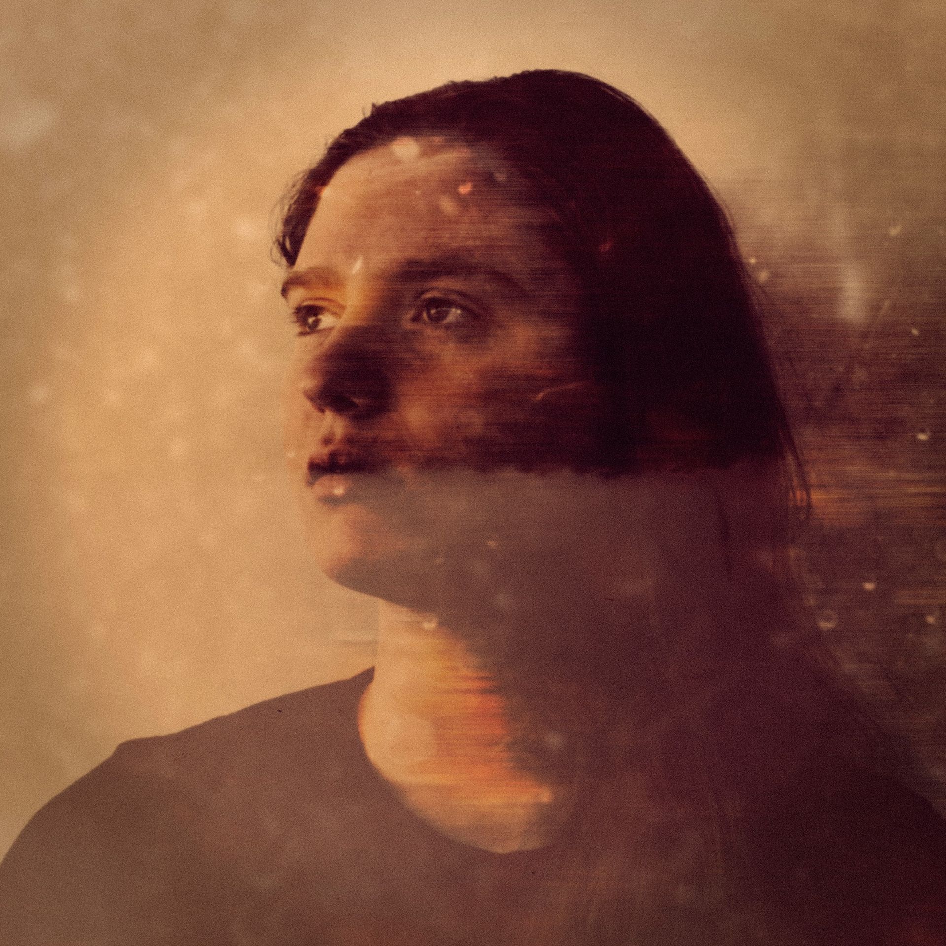 A double exposure photo of a woman 's face