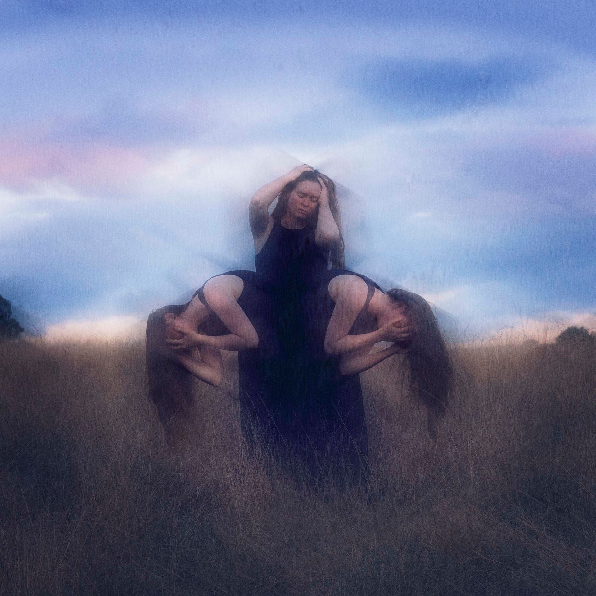 A blurry picture of two women standing in a field