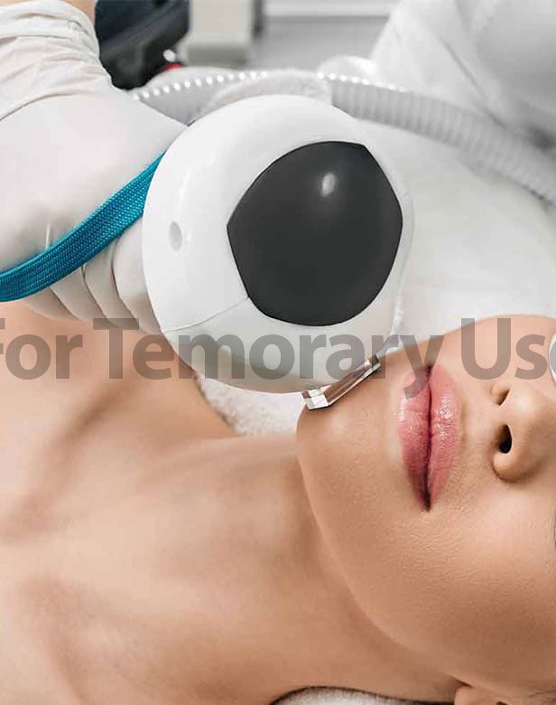 Woman receiving a skin treatment on her face. A device is being used on her chin.