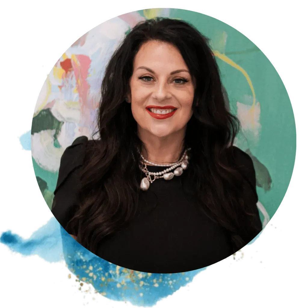 Woman with dark hair smiles, wearing a black top and pearl necklace, set against an abstract floral background.