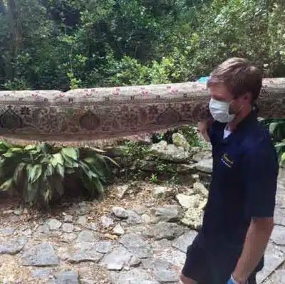 Man Carrying The Rug — Austin, TX — Aegis Fine Rug Cleaning