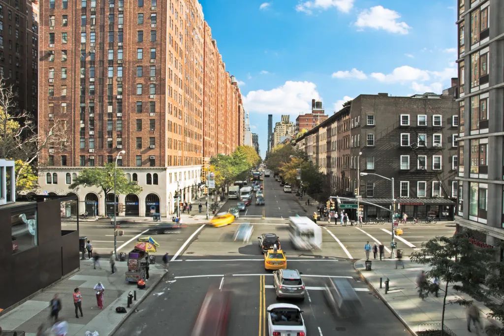 A city street with a lot of traffic and buildings