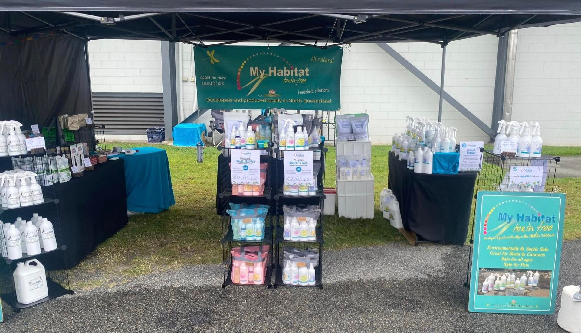 Person Spraying Insect Repellent onto Another Person's Arm Outdoors — My Habitat Products in Malanda, QLD