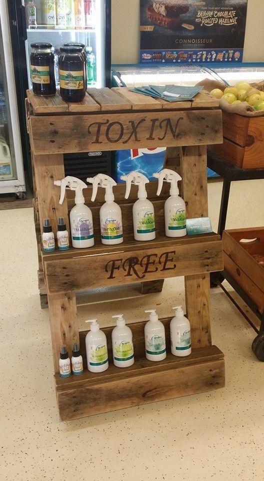 Person in Pink Gloves Cleaning a Wooden Desk with A Spray Bottle, Purple Cloth — My Habitat Products in Malanda, QLD
