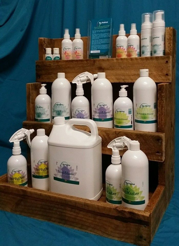 Wooden Display Stand Holding Various White Bottles of Cleaning Products — My Habitat Products in Malanda, QLD