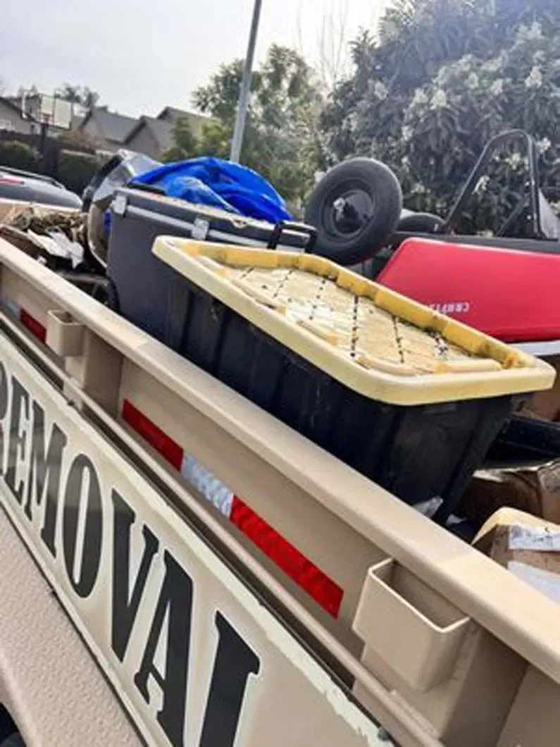 A truck with a removal sign on the back of it