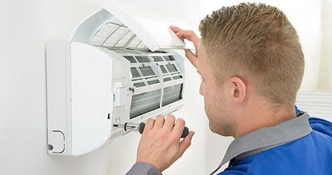 Technician Repairing the A/C Machine - Air Conditioning in Orange County, CA