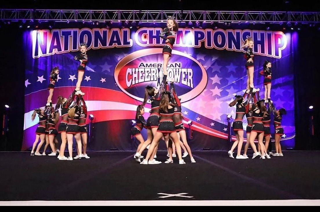 Cheerleaders Performing Stunts at A Competition — Cedar Park, TX — Tech Cheer