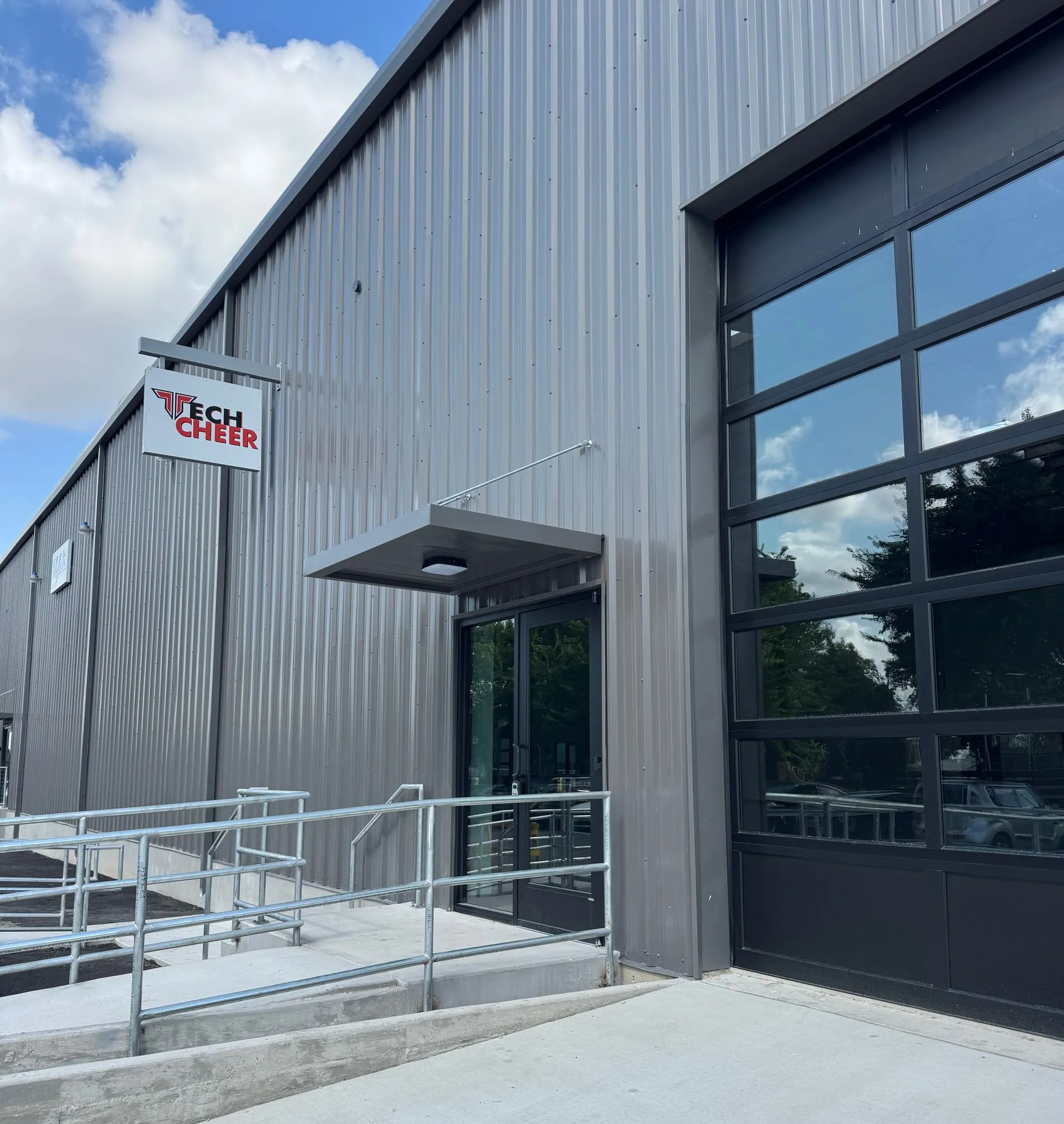 Modern Metal Building with A Sign and Glass Door — Cedar Park, TX — Tech Cheer