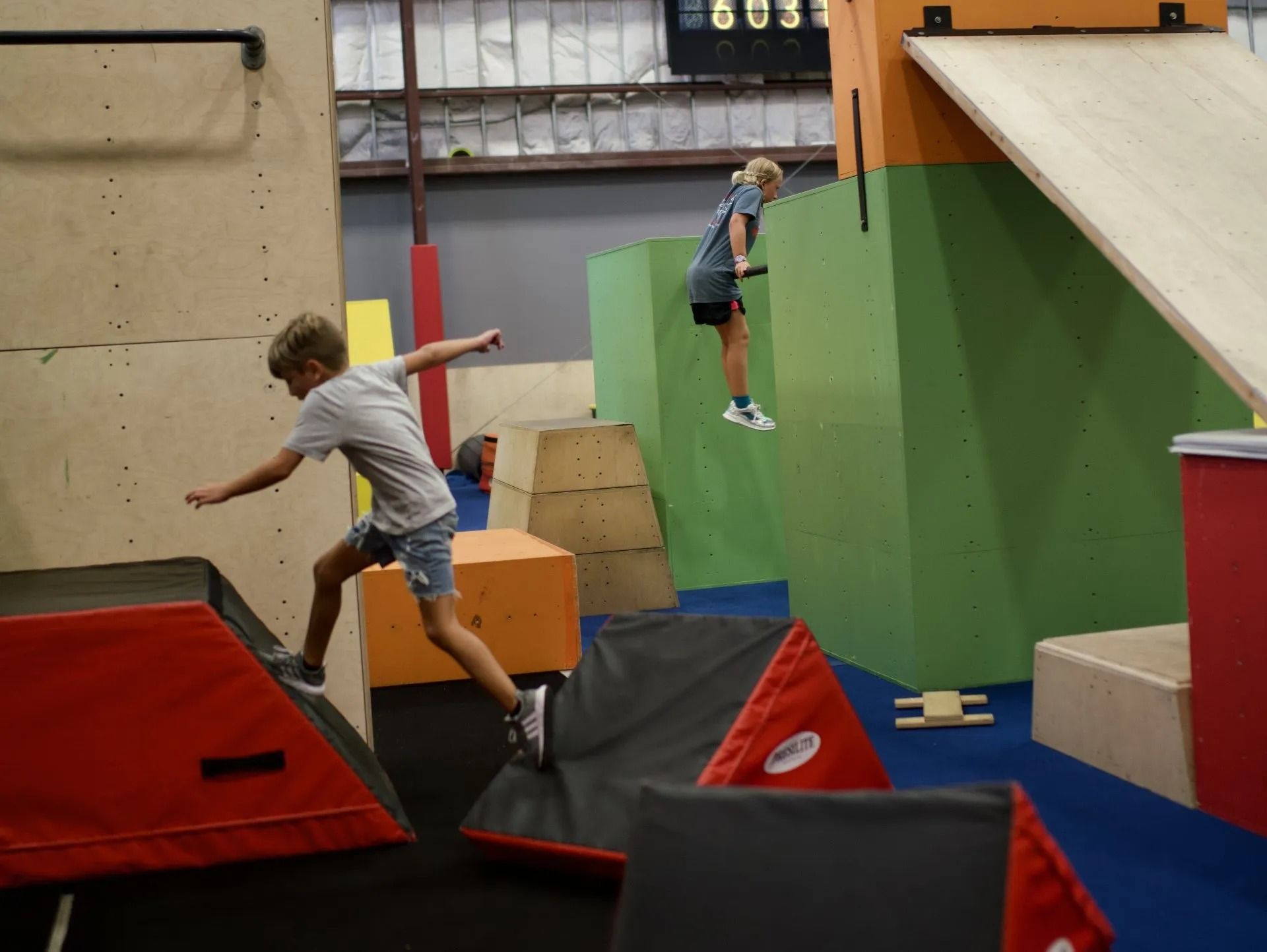 Two Children in An Indoor Parkour Gym — Cedar Park, TX — Tech Cheer
