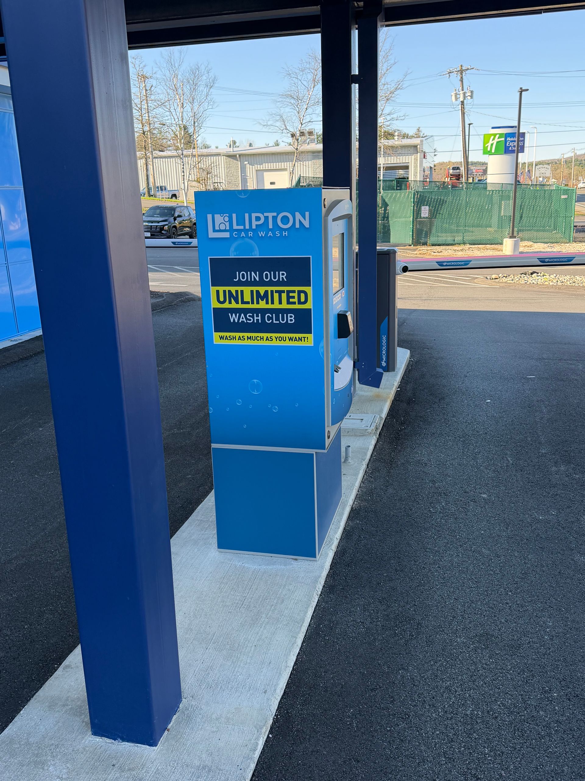 Black car interior with yellow gauge cluster and modified steering wheel.