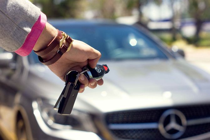 Woman using the car remote