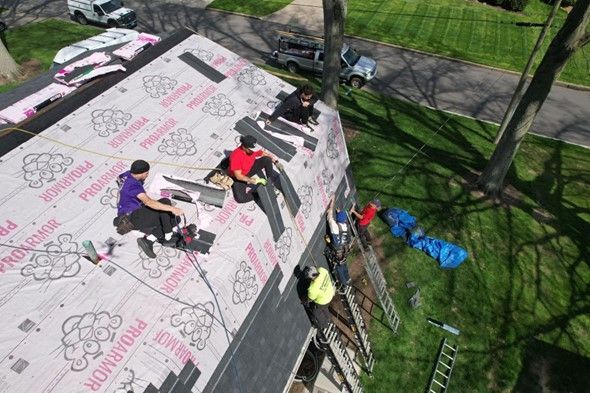 Working people on top of a roof