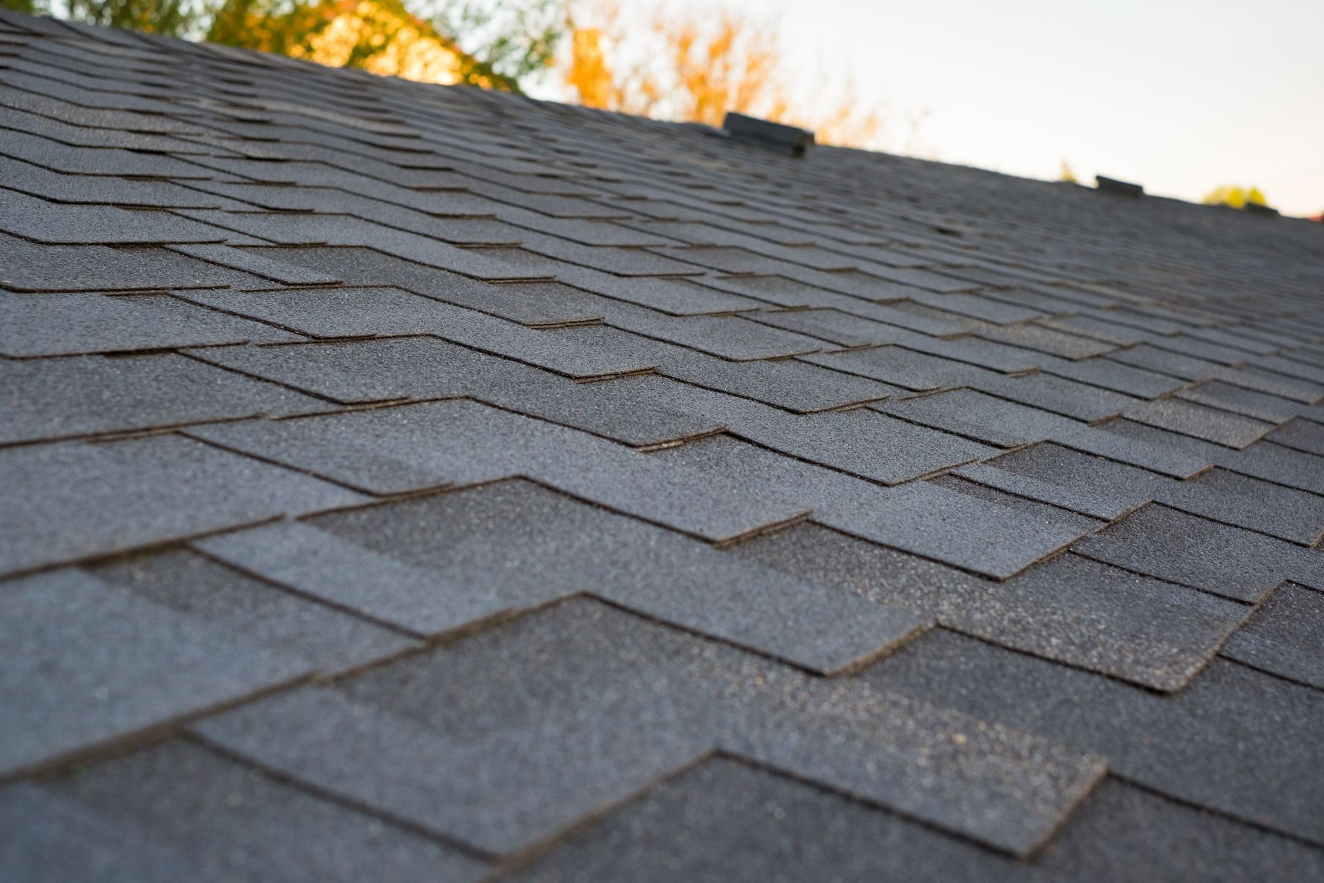 A close up of a roof with shingles on it.