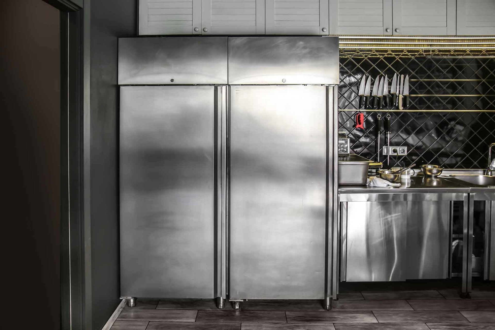 Well-maintained equipment in a restaurant kitchen, showcasing commercial refrigeration service. Well-maintained equipment in a restaurant kitchen, showcasing commercial refrigeration service.