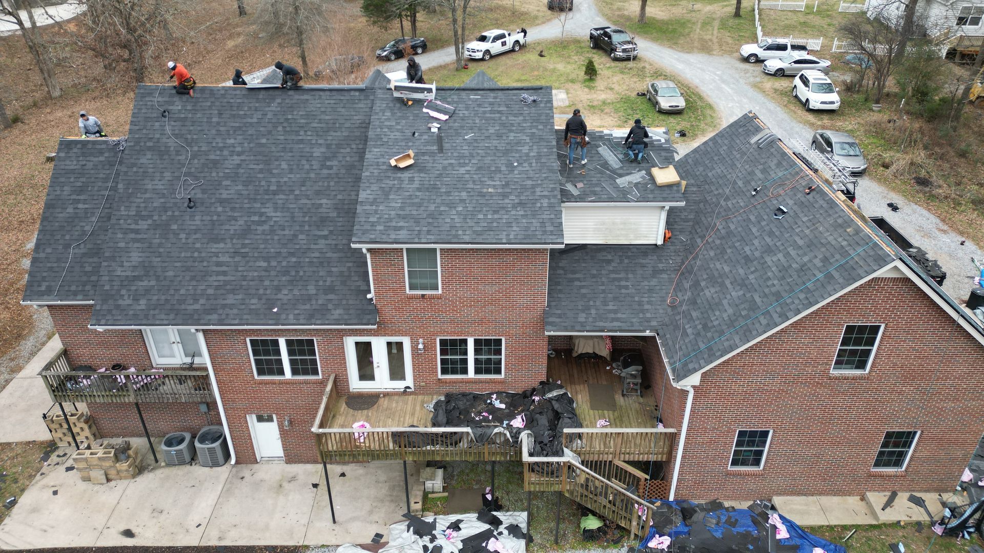 New gray shingle roof on two-story home by Red Line Roofing in Dickson, TN