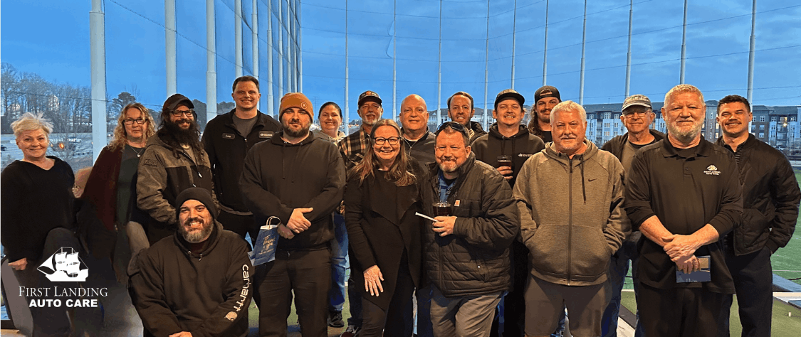 First Landing team posing outdoors at Top Golf