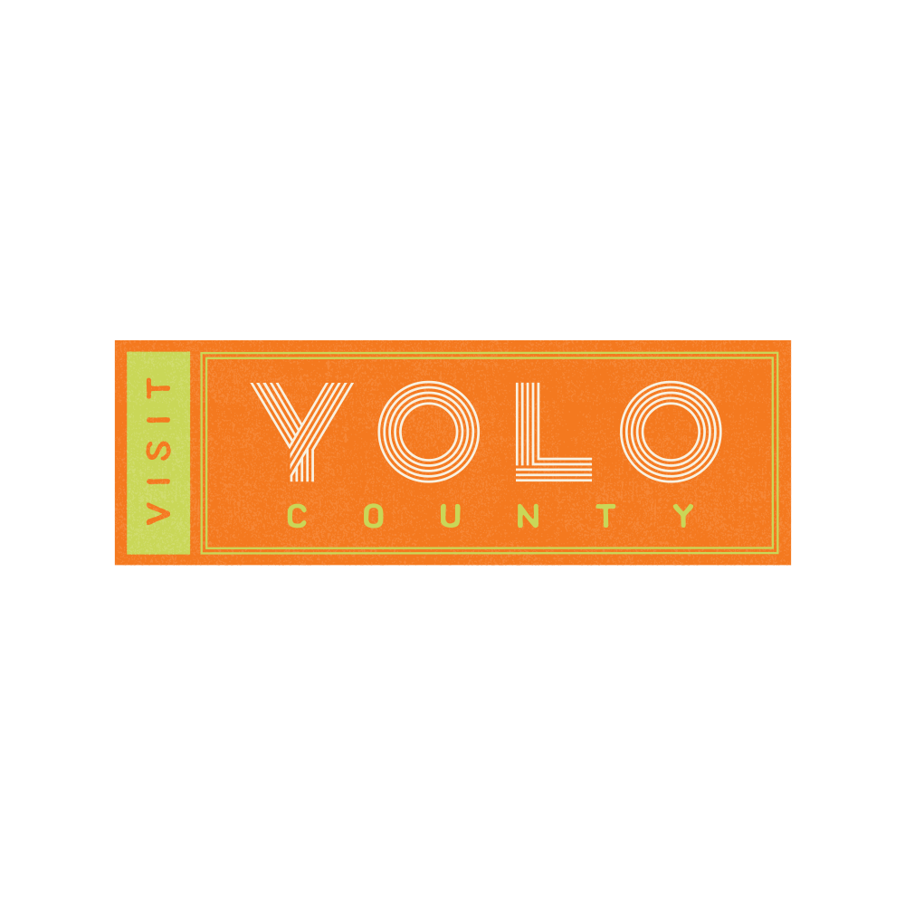 Visit Yolo County logo: orange rectangle with text 