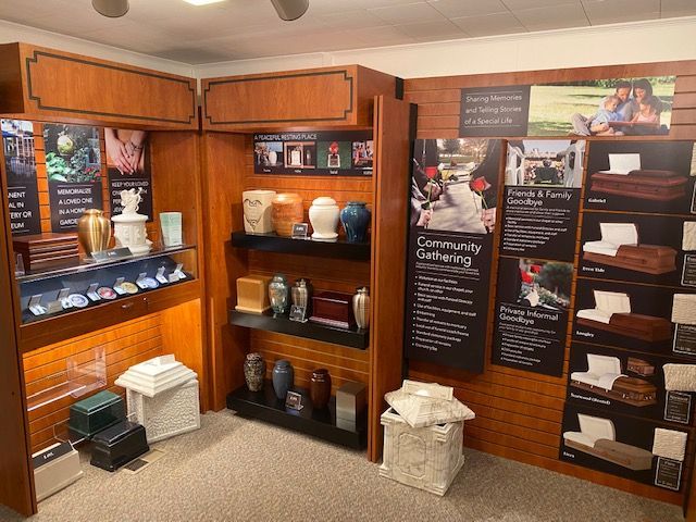 A room filled with lots of urns and coffins.