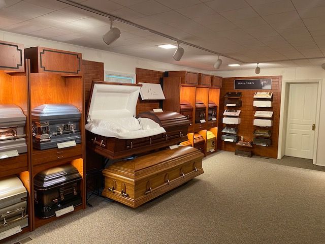 There are many different types of coffins in this room.