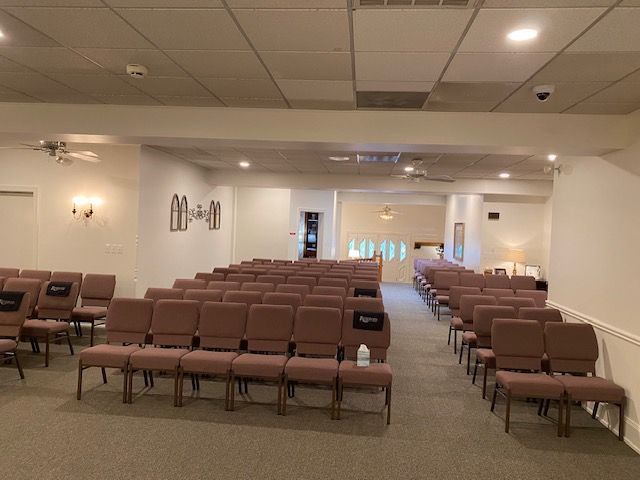 A large room with rows of chairs in it